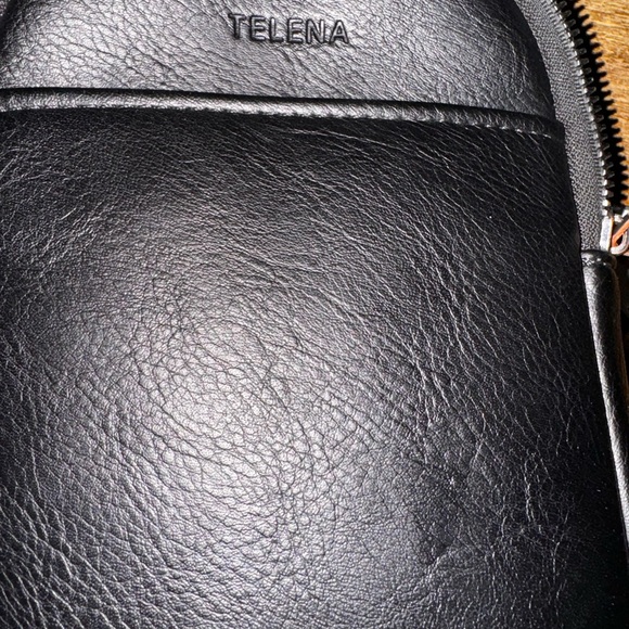 Black Vegan leather cross body bag. It has a few compartments can hold phone - Picture 2 of 4